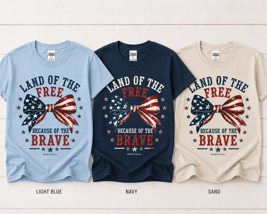 Land of the Free Because of the Brave Flag Bow Graphic Tee